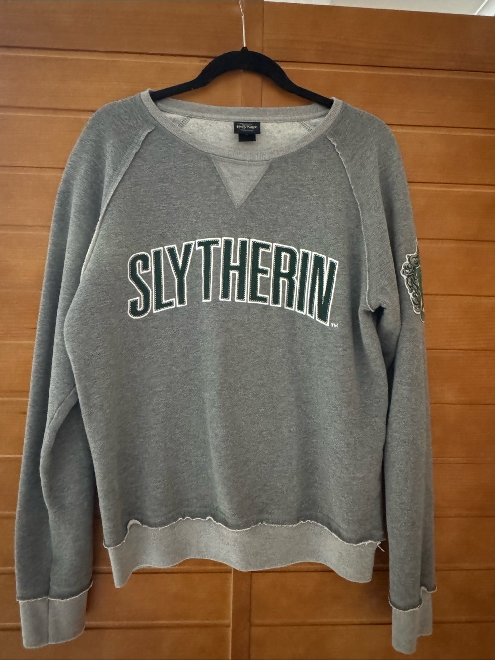 Universal Gray Slytherin Crewneck Sweatshirt with Green Lettering